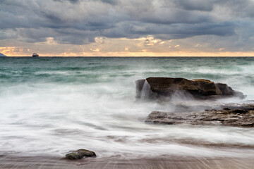 Sunset at Azkorri beach in the coast of Biscay, Basque Country, north of Spain. 
