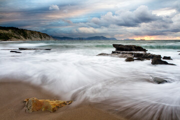 Fototapeta premium Sunset at Azkorri beach in the coast of Biscay, Basque Country, north of Spain. 
