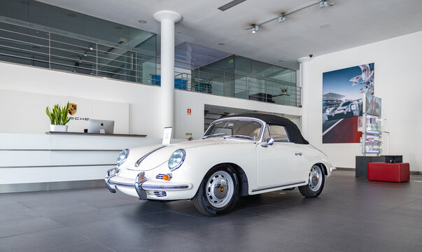 Matosinhos, Portugal - June 25, 2022: A picture of a white 1964 Porsche 356 C 1600 SC Coupé inside a dealership.