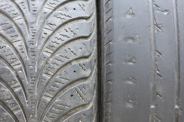 Old winter and summer tires with varying degrees of wear