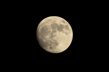 Sharp image of the moon nearly full shown against a dark sky. Image taken in Pasadena, California.