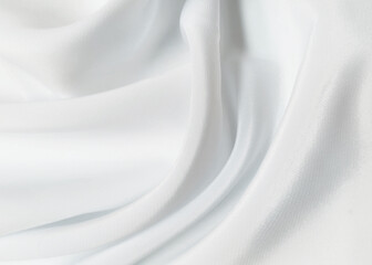 Plakat White crumpled or wavy fabric texture background. Abstract linen cloth soft waves. Creases of satin, silk, and cotton. Smooth elegant silk or atlas luxury cloth texture. Bedding Sheets or blanket.