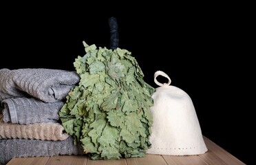 Russian or Finland sauna stile photography. Bathroom with bath broom surrounded by a washcloth and...