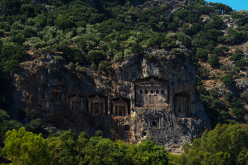 Fototapeta na wymiar Lycian tombs near Dalyan across the Dalyan river in Mugla Province located between the districts of Marmaris and Fethiye on the south-west coast of Turkey