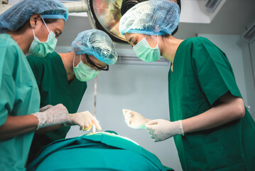 Asian doctor surgeon team,  Working in the operating room, Doing  surgery  patients, to people and...