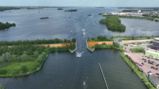 Aqueduct Veluwemeer near Harderwijk transport asphalt motorway road for traffic crossing underneath a waterway river lake infrastructure in the Netherlands. Holland