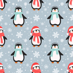 Christmas seamless pattern with cute cartoon penguins and and snowflakes.