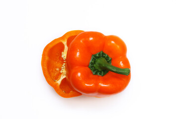 Orange pepper in a cut on a white background. Close-up