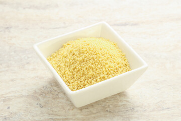 Raw couscous in the bowl