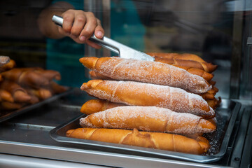Typical handmade Churro stuffed with delicacy from Lima, near its main square in Peru
