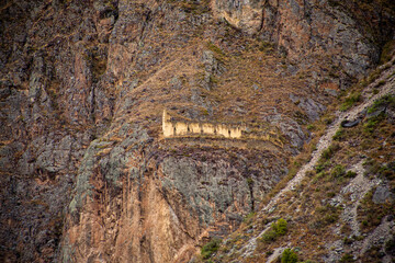 Barn and crop cellar in Inca ruins at Ollantaytambo in the Sacred Valley in Cusco, Peru