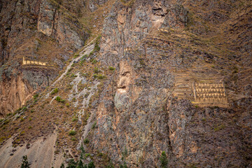 Barn and crop cellar in Inca ruins at Ollantaytambo in the Sacred Valley in Cusco, Peru