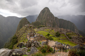 General view of Inca Citadel called Machupichu built of stones in the mountain, cloudy day, Peru