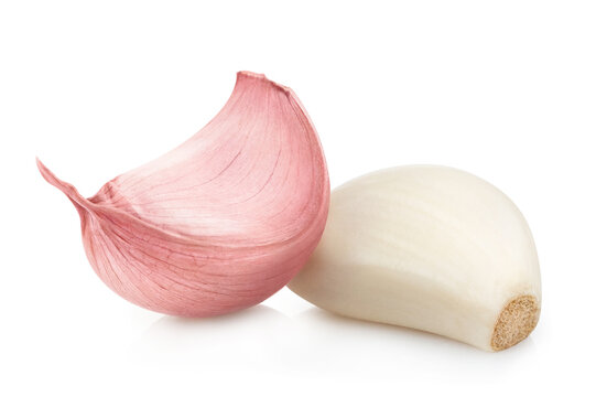 Two delicious garlic cloves, isolated on white background