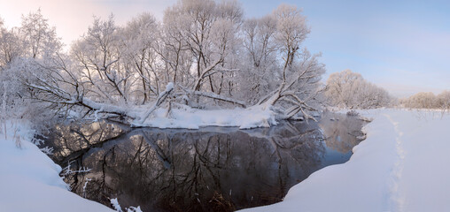Winter landscsape with forest river