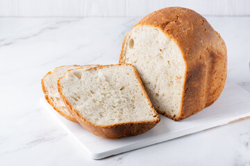 Fresh bread on the kitchen table. The healthy eating and traditional bakery concept