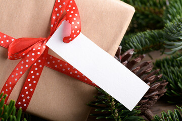 Christmas rectangle strip gift tag mockup with present box, product label mockup, with natural fir...
