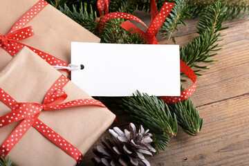 Christmas rectangle gift tag mockup with present box, product label mockup, with natural fir tree...
