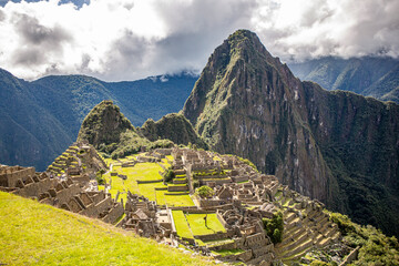 General view of Inca Citadel called Machupichu built of stones in the mountain, cloudy day, Peru