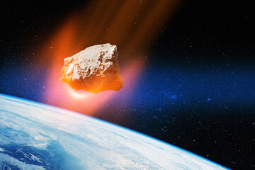 Planet Earth and big asteroid in the space. Potentially hazardous asteroids. Asteroid in outer...