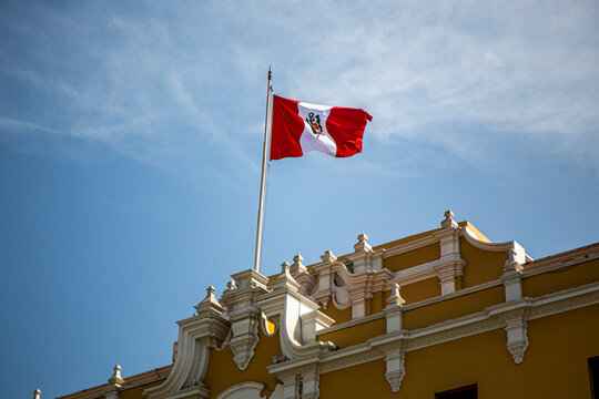 Peru flag waving in the blue sky