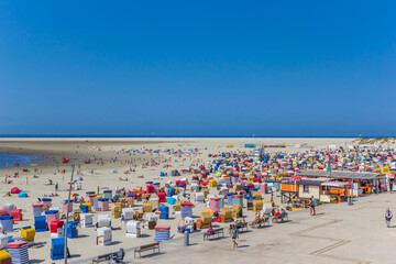 Colorful traditional beach chairs at the boardwalk of Borkum, Germany