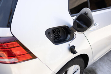 type 2 CCS plug port on electric vehicle. Fast charging socket type 2 combo electric car. DC - CCS...