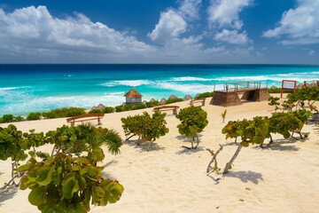 Sandy beach with azure water on a sunny day near Cancun, Mexico