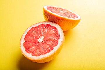 Grapefruit, grapefruits positioned on yellow EVA surface, selective focus.