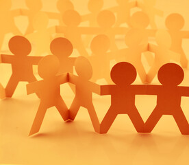 Group of paper chain people united together