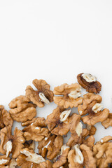 Half peeled walnut closeup isolated on white background