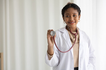 African doctor holding and showing stethoscope for medical examination
