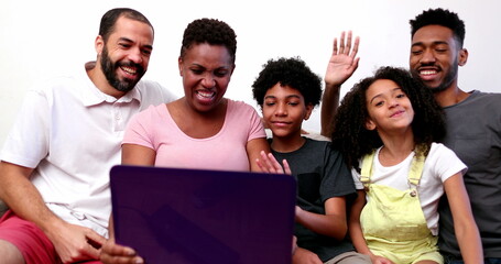 Black family waving hello or good bye to relative on video conference