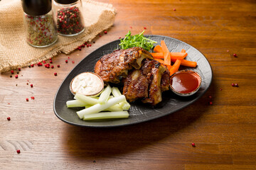 Barbecue pork ribs with sauce on wooden table