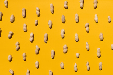 Group of peanuts isolated on yellow background