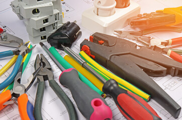 Composition of power tools for an electrical installer close-up.Sunflare.