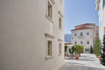 Fototapeta na wymiar Buildings with stone beige walls, elegant architecture