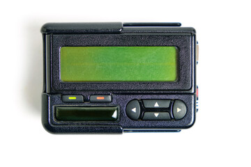 Pager old retro communication device, white background.Outdated technologies.