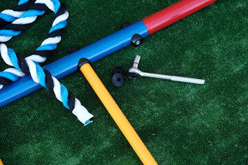 Details of a childrens sports complex, a ladder on a green background close-up, the assembly process