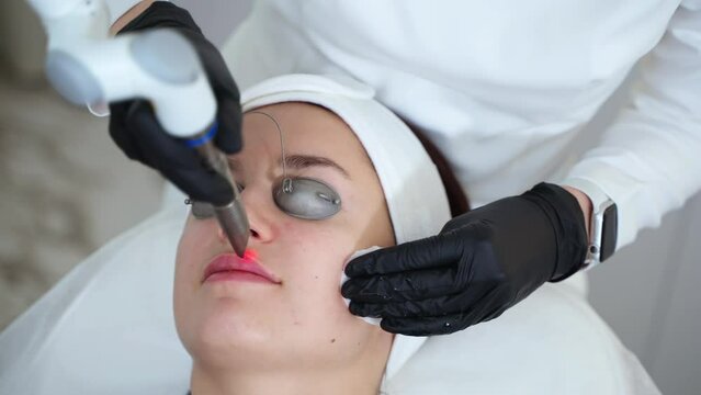 Lips rejuvenation with YAG laser at cosmetology clinic