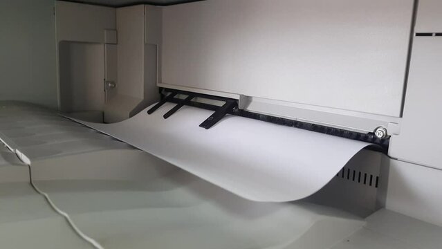 A high-capacity office printer prints many documents on an A4 page