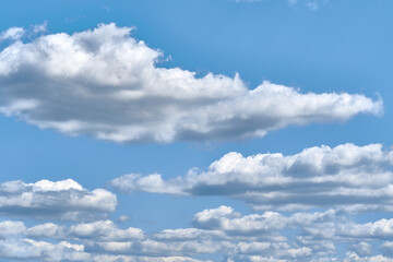 Cumulus clouds on blue sky, copy space . Background for text.