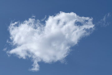 One white cloud in the blue sky.