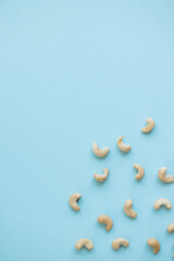 Cashew nuts isolated on blue background
