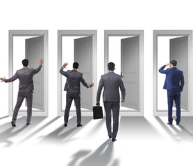 Fototapeta premium Businessman in uncertainty concept with many doors