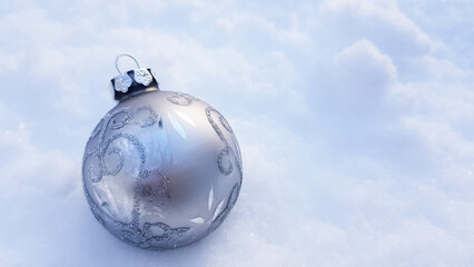 A Christmas tree toy in the form of a ball in shades very characteristic of the fashionable new year 2022. pantone color