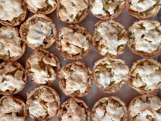 Baked mini apple pies - view from the top, pattern, closeup