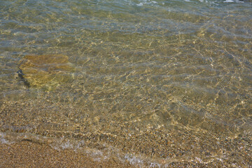 Blurred waves of clear seawater as a background