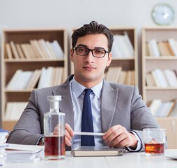 Businessman drinking in the office