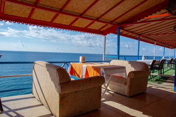 Cafe by the sea. Beautiful sea view, tables and chairs.